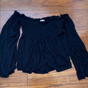 black flows off the shoulder